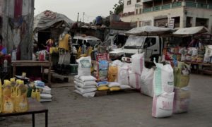Diverted aid supplies for sale at a public market in Aden