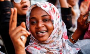 A Sudanese woman chants slogans outside the army headquarters in Khartoum
