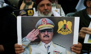 A protester carries a picture of Khalifa Haftar in Benghazi, Libya, April 2019. Photograph: Esam Omran Al-Fetori/Reuters
