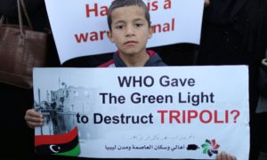 A protester demands an end to Haftar’s offensive against Tripoli, 12 April
