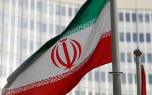 The Iranian flag flutters in front the International Atomic Energy Agency